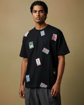 The Passport Collage Oversized Fit T-Shirt in Black